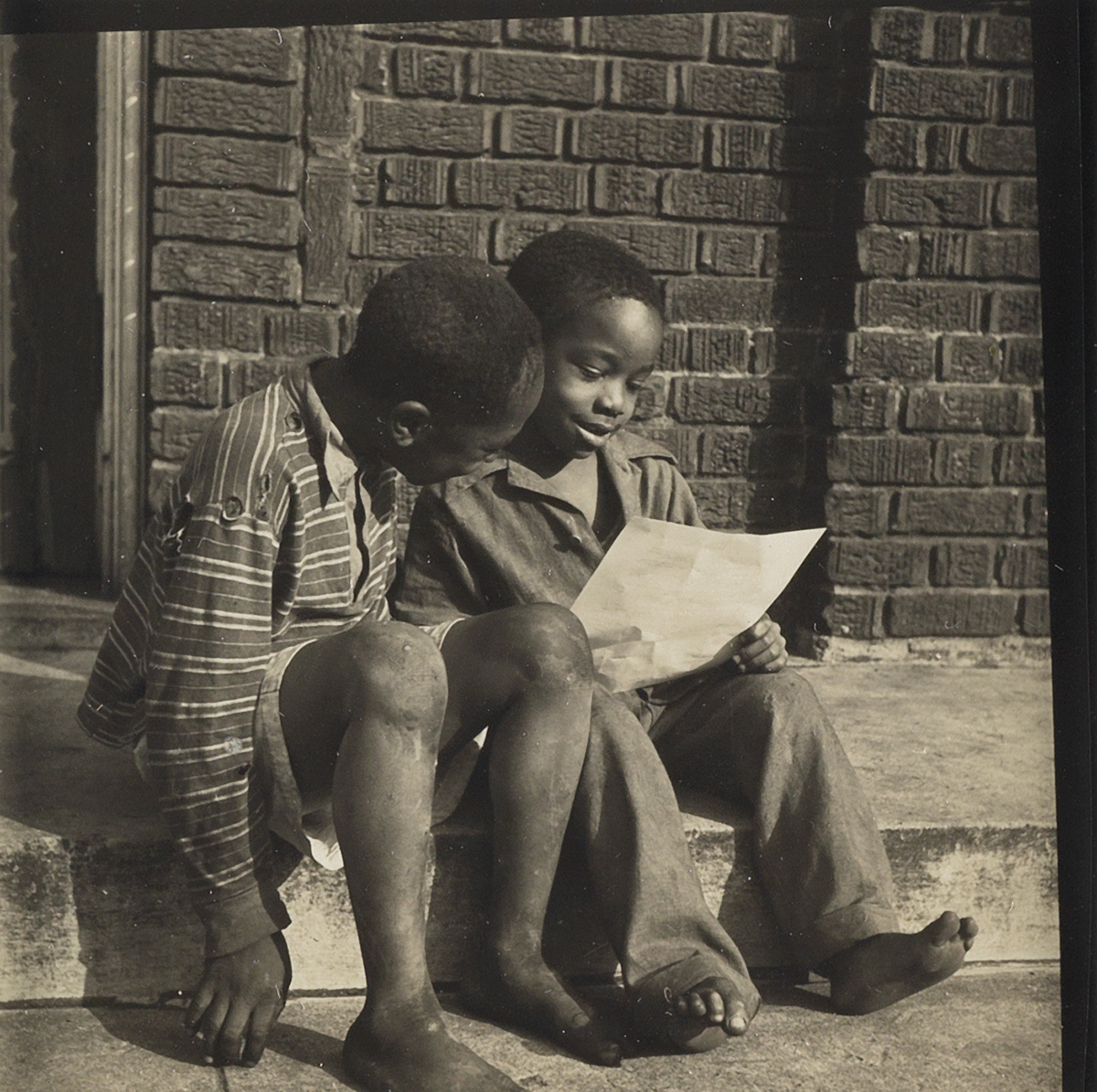 GORDON PARKS (1912-2006) Two boys reading.
